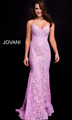 A woman poses against a black background in the Long Prom Dress 37334 by Jovani—a form-fitting lavender lace gown with a strapless sweetheart neckline. "JOVANI" is displayed on the left, highlighting this elegant formal dress.