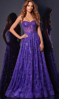 A woman in the Long Prom Dress: Jovani 37413, featuring a strapless sequin design and corset bodice, stands against a dark background with her reflection elegantly visible behind her.