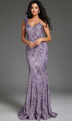 A woman with wavy dark hair wears the Jovani 37634 long lavender prom dress, featuring sequins, floral patterns, and a single shoulder strap adorned with a fabric flower.