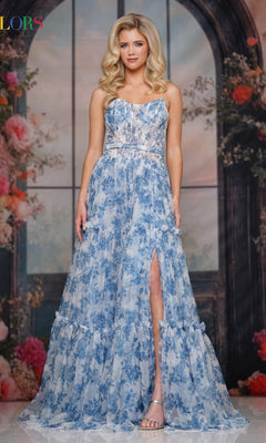 A woman models the Strapless Long Print Prom Dress: Colors Dress 3810—a strapless, floral-print gown with a high slit—standing before a floral and arch backdrop.