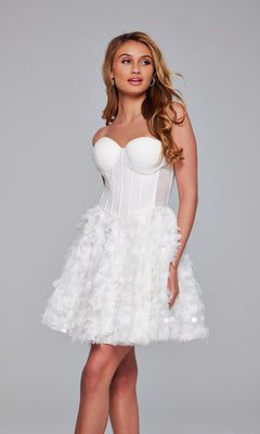 A woman models the Jovani Strapless Short White Hoco Dress 38248, featuring a textured knee-length skirt, as she stands against a plain gray background—showcasing the perfect short white homecoming dress.