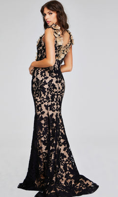 A woman wearing the Jovani 38497 long black & nude formal dress, featuring a fit-and-flare silhouette and 3D flower shoulder details, stands against a plain light background.