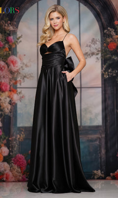 A woman in a black Back-Bow Strappy Prom Gown (Colors Dress 3851) featuring a long A-line silhouette and strappy-back design.
