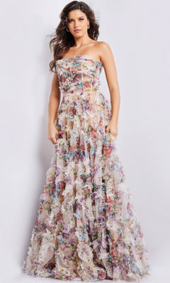 A woman poses against a plain white background wearing the Jovani Strapless Long Print Prom Dress 38650, featuring a colorful floral pattern and sheer bodice.