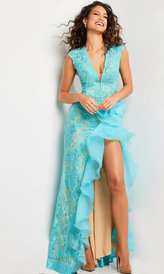 A woman models the Jovani Ruffled Long Lace Prom Dress 38668, featuring a sleeveless turquoise beaded lace design with a deep V-neckline and ruffled high slit, set against a plain light-colored background.