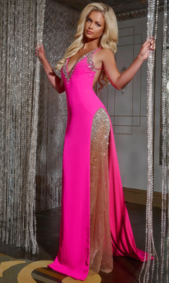 A woman stands between beaded curtains, wearing the Jovani 38983 long prom dress featuring hot pink fabric, jeweled details, sheer side panels, and an elegant open back.