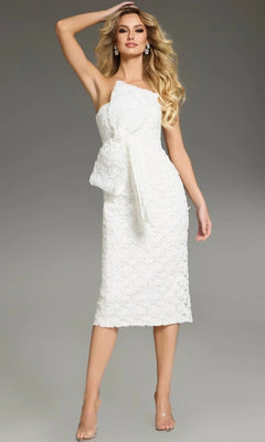 A woman is posing with one arm raised against a plain gray background, wearing the Jovani 39076 Midi Wedding Guest Dress in white—a sleeveless, knee-length design featuring a textured fabric and prominent bow detail.