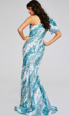 A woman stands facing away, wearing the Jovani 39077 long formal dress—a fit-and-flare, one-shoulder aqua and silver sequin evening gown with a slight train.