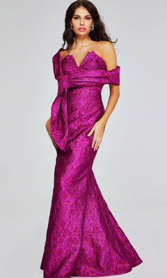 A woman poses elegantly against a plain light background in the Jovani 39114, a long formal off-shoulder magenta gown featuring a textured floral pattern and mermaid silhouette.