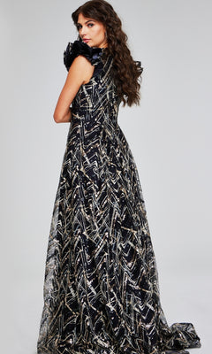 A woman with long wavy hair poses with her back to the camera in a glamorous Jovani 39274 long formal dress, featuring a sleeveless design and a floor-length black and silver pattern.