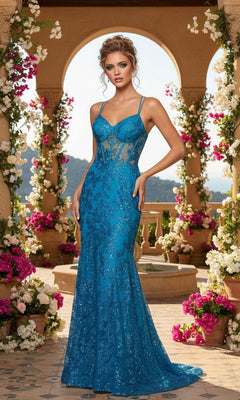 A woman poses in a floral archway wearing the Blondie Nites 3960BN Long Glitter Prom Dress, a sleeveless blue fitted evening gown with sheer panels and lace details.
