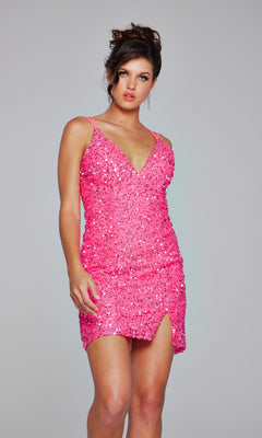 Woman wearing the Jovani Lace-Up Short Beaded Homecoming Dress 39630, a bright pink mini dress with thin straps and V-neckline, posing against a plain light gray background.