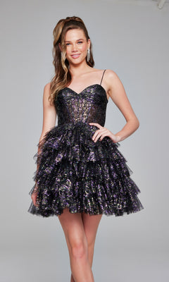 A woman stands smiling against a plain background, wearing the Short Black Glitter Hoco Dress: Jovani 39654, featuring a sparkly finish and a layered ruffle skirt.
