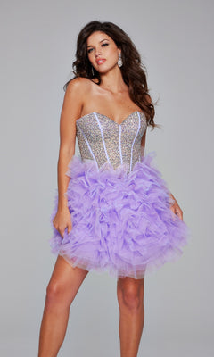 A woman poses against a gray background in the Jovani 39748 Strapless Short Purple Hoco Dress, featuring an embellished sweetheart corset, sparkling silver bodice, and ruffled lavender tulle skirt.