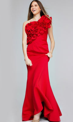 Woman wearing the Jovani 39751 long formal dress—a floor-length, bright red mermaid gown with one-shoulder floral applique—standing and smiling against a plain background.