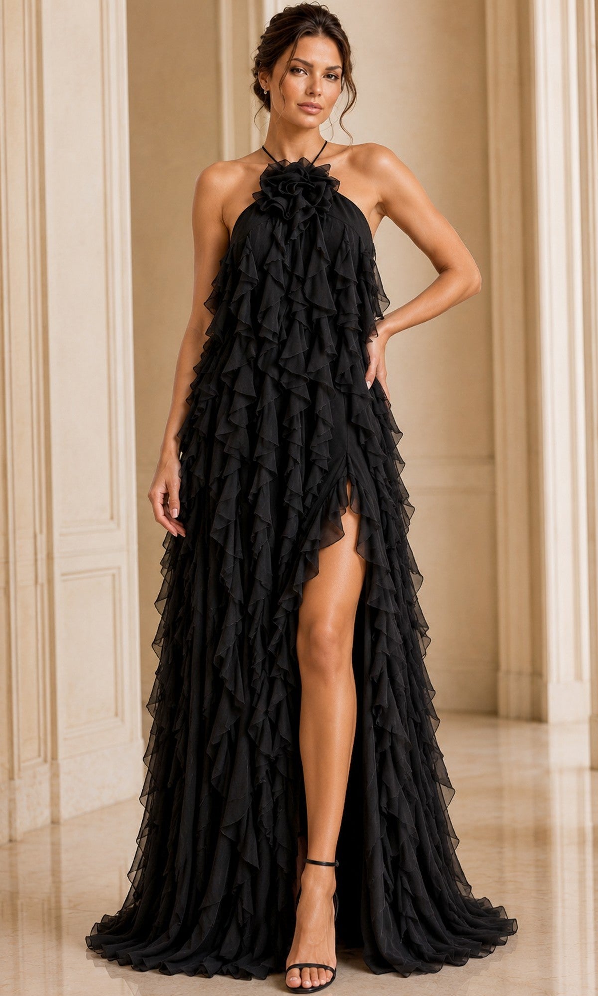Wearing the Long Formal Dress: Jovani 39823—a black halter chiffon gown featuring elegant ruffle layers and a high slit—a woman stands in an elegant room with light-colored walls and open-toed heels.