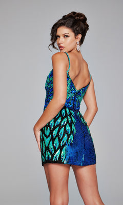 A woman in the Short Sequin-Print Hoco Dress: Jovani 39907, featuring blue and green sequins with a peacock feather pattern, stands slightly turned away, looking over her shoulder.