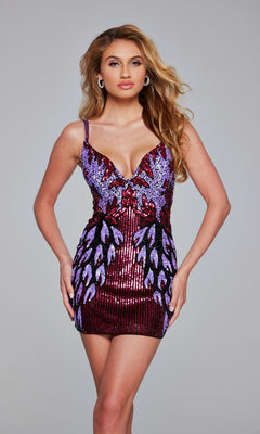 A woman stands against a plain gray background wearing the Jovani 39907 Short Sequin-Print Hoco Dress, featuring a sleeveless design, deep V-neckline, and a purple and red feather-like sequin pattern.