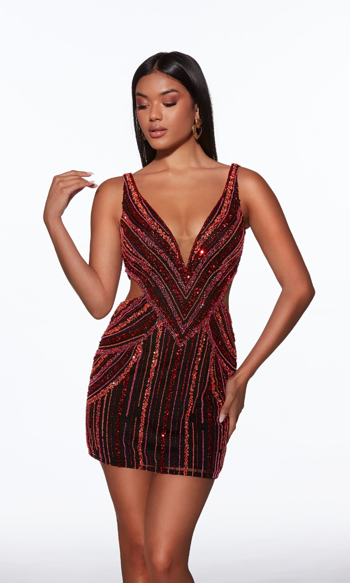 A woman models the Alyce 40012 short homecoming dress, featuring red sequin stripes, a sleeveless design, plunging V-neckline, and an open V-back, standing against a plain white background.