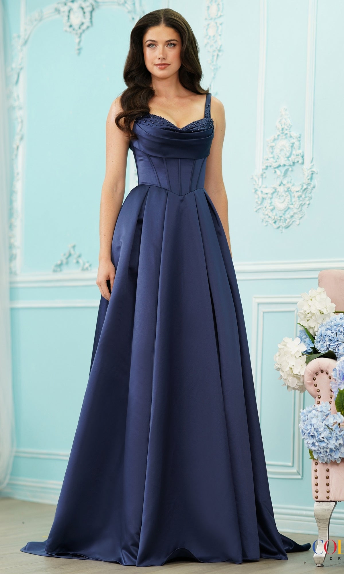 Blueberry-colored satin Long Prom Dress: Colors Dress 4001, featuring a floor-length skirt with pockets, a corset-style bodice, and a beaded cowl neckline.