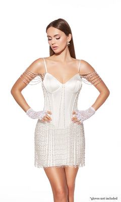 A woman wears the Alyce 40064 short homecoming dress—a white, off-the-shoulder, beaded bodycon style with sheer straps. Lace gloves shown are not included.