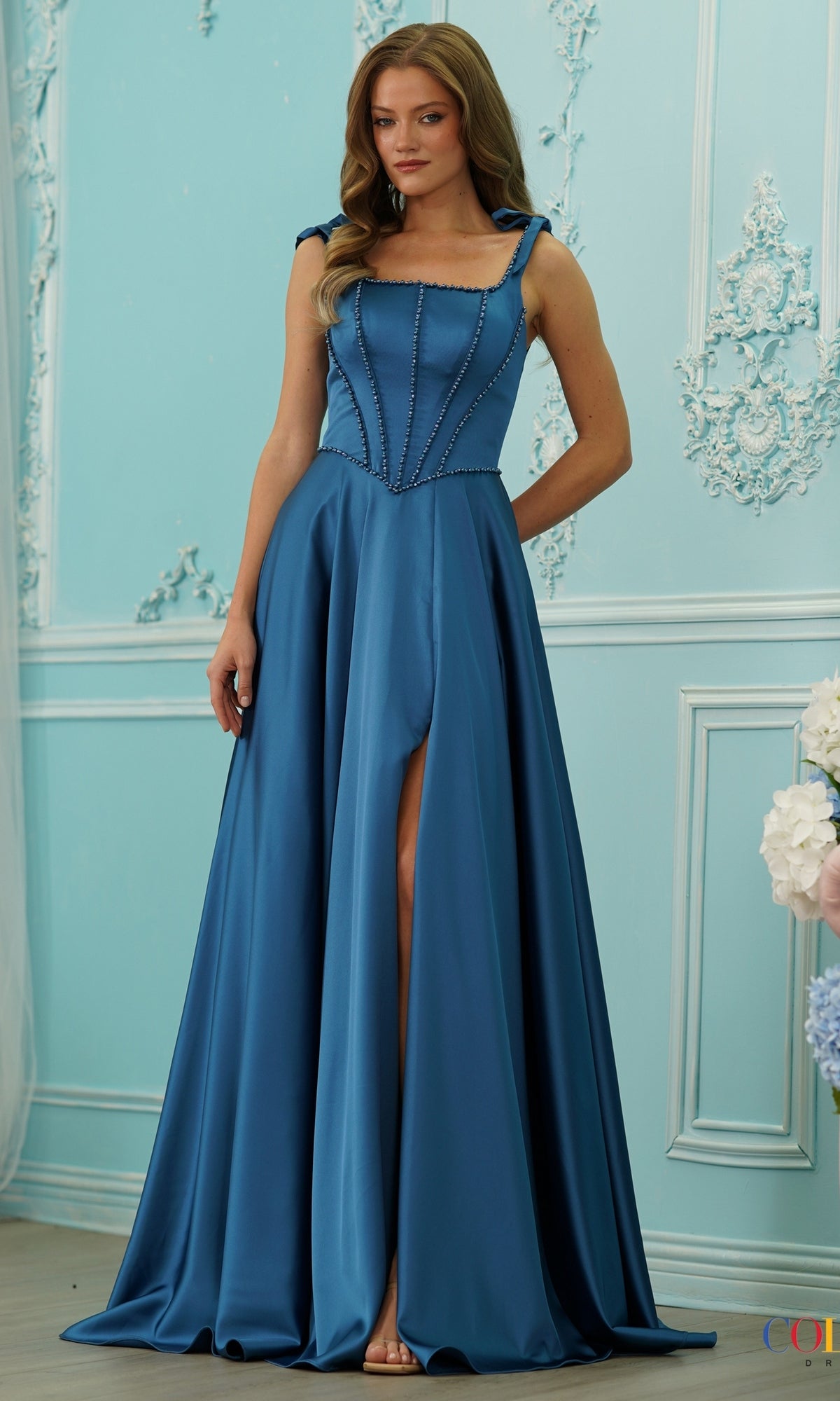 Teal Long Prom Dress: Colors Dress 4006 with a floor-length satin skirt, corset-style bodice, thin straps, and a front slit.