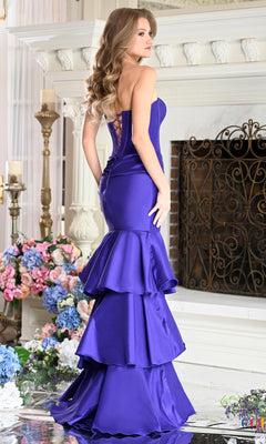 A woman wearing the Long Prom Dress: Colors Dress 4007, a purple, strapless mermaid style with a lace-up corset back and a tiered, ruffled hem.
