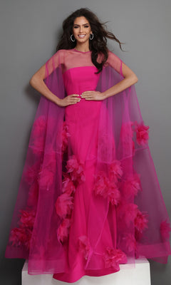 A woman stands against a gray background with her hands on her hips, making a bold formal statement in the “Long Formal Dress: Jovani 40092”—a vibrant pink designer gown featuring a sheer cape and delicate floral appliques.