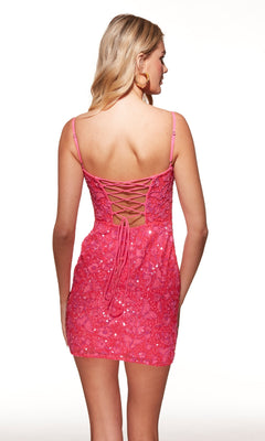 Woman in the Alyce 40100 short pink sequin homecoming dress with spaghetti straps and lace-up back, photographed from behind against a plain background.