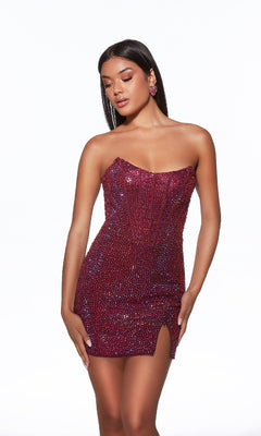 Model wearing the Alyce 40104 short homecoming dress, a strapless bodycon design with red sequins and a thigh-high slit, posing confidently against a white background.