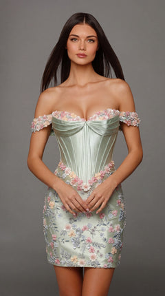 A woman stands facing forward against a plain gray background, wearing the Alyce 40175 short homecoming dress in celadon—a strapless stretch-satin design featuring delicate 3D floral embroidery, making it an exquisite choice for homecoming.