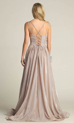 A woman stands with her back to the camera in the Lace-Up Back Long Metallic A-Line Prom Dress 4022, featuring shimmery fabric, thin crisscross straps, and a lace-up corset back.