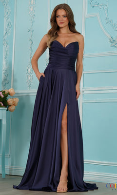 A navy Long Prom Dress: Colors Dress 4026, featuring a strapless floor-length draped design with a fitted bodice, pockets, and a high leg slit.
