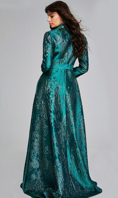 A woman with long brown hair stands facing away, wearing the shiny teal Jovani 40297 long formal dress with a high collar and long sleeves, set against a plain gray background.