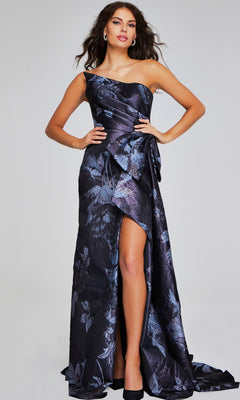 A woman poses in the Jovani 40308 long formal dress, featuring a dark floral jacquard pattern, thigh-high slit, and black high heels against a plain background.