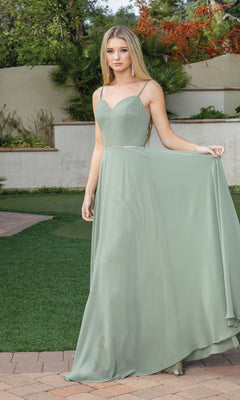 A woman wearing the Simple Long A-Line Prom Dress with Corset Back stands outdoors on a brick path, holding out her floor-length light green skirt to show off the elegant flow of this affordable formal gown.