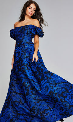 A woman wears the Jovani 40315 long formal dress—an off-the-shoulder ball gown with puff sleeves and blue-black patterned fabric, perfect for special occasions.