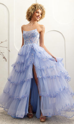 A woman stands against a white backdrop wearing the Amelia Couture 4033 Ruffled Strapless Prom Dress with tiered tulle layers, a sequin corset bodice, floral accents, and a high front slit.
