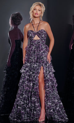 A woman in the Jovani 40423 purple floral-print long halter prom dress poses amid mirrored reflections, showcasing its ruffles and thigh-high slit.