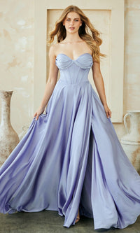 Woman wearing a strapless, light purple gown in an elegant indoor setting.