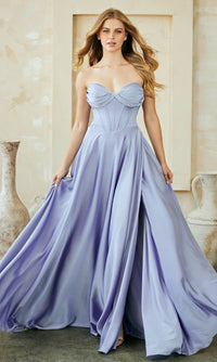 Woman wearing a strapless, light purple gown in an elegant indoor setting.