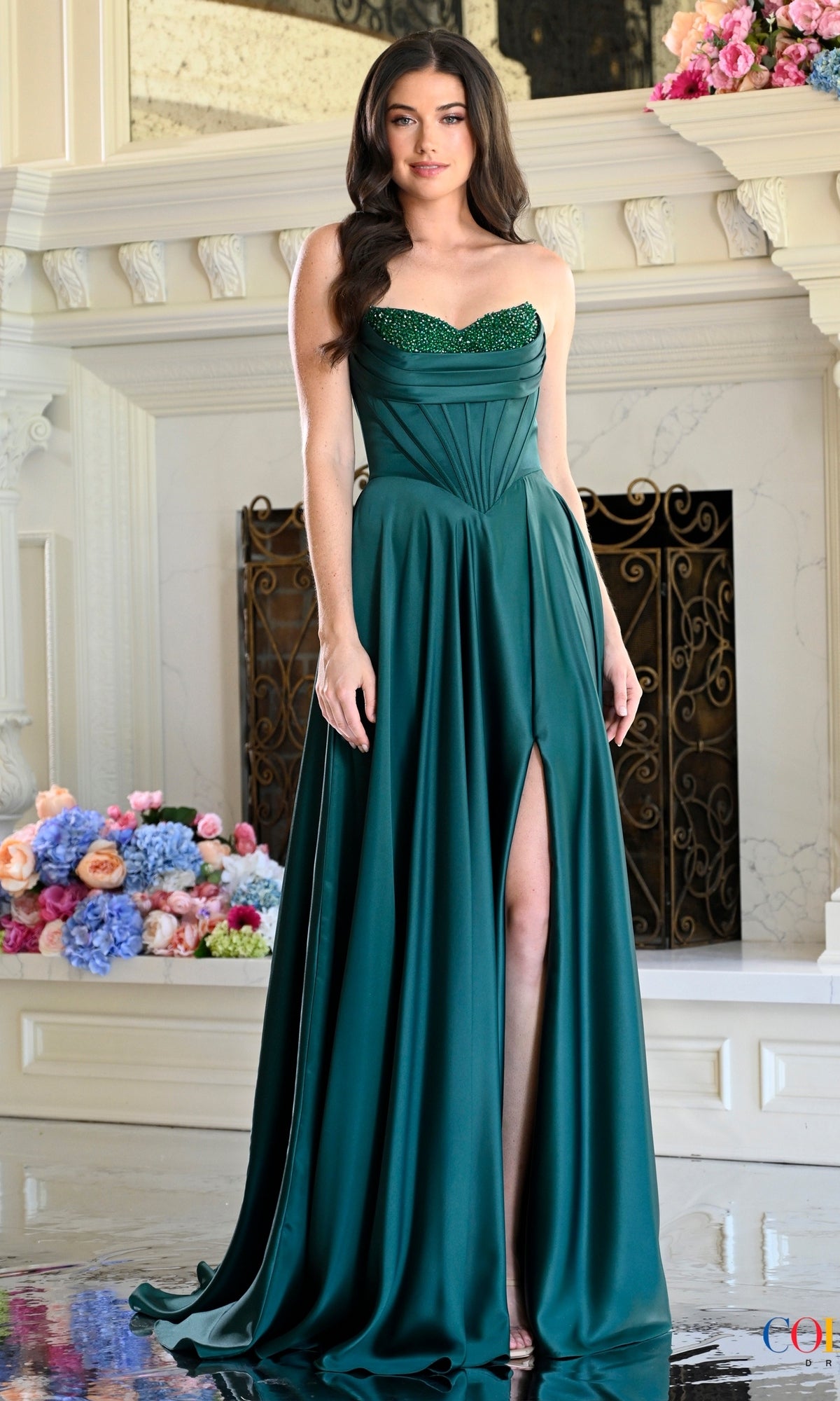 Deep green Colors Dress 4057 long prom dress featuring a strapless floor-length silhouette, a rhinestone sweetheart neckline, and a high front slit.