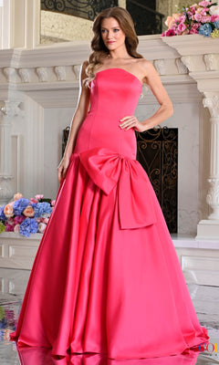 Hot pink, strapless, floor-length satin Colors Dress 4058 prom dress featuring an oversized bow at the waist.