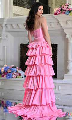 A person wearing a pink Long Prom Dress: Colors Dress 4061 with a strapless sweetheart neckline, corset bodice, and a tiered, ruffled floor-length skirt.