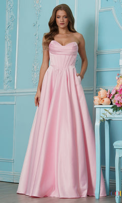 A model wearing the pink Long Prom Dress: Colors Dress 4063, a strapless, floor-length satin A-line gown with a pleated sweetheart neckline, corset-style bodice, and side pockets.