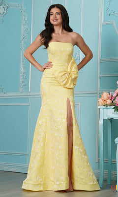 A woman wears a yellow floral jacquard strapless floor-length mermaid Long Prom Dress: Colors Dress 4065 with a side bow and a high leg slit.