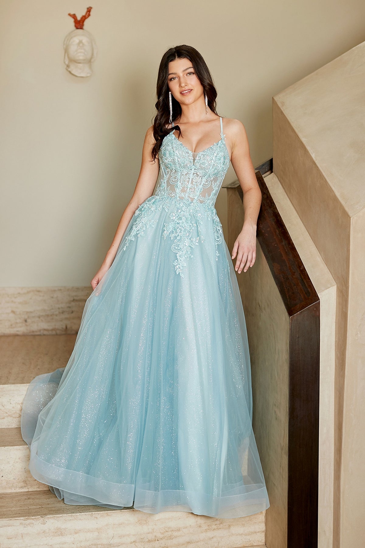 Amelia Couture 4074 seafoam floor-length prom dress featuring a sheer bodice, delicate lace appliqués, and a glittery tulle skirt.