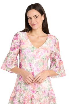 Woman wearing the R&M Richards 4107 Short Ivory Floral Party Dress with flared three-quarter sleeves, standing and smiling—a stylish choice for those seeking a casual cocktail dress.