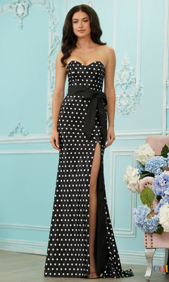 Long Prom Dress: Colors Dress 4114, a black, strapless prom dress with white polka dots, a sweetheart neckline, a black waist sash, and a floor-length silhouette with a high side slit.