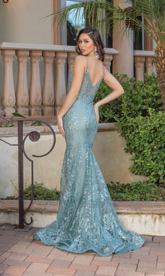 A woman poses outdoors in a Long Sequined and Beaded Mermaid-Style Prom Dress, light blue with a fitted silhouette, sequin detailing, and mermaid skirt, facing away from the camera while looking over her shoulder.